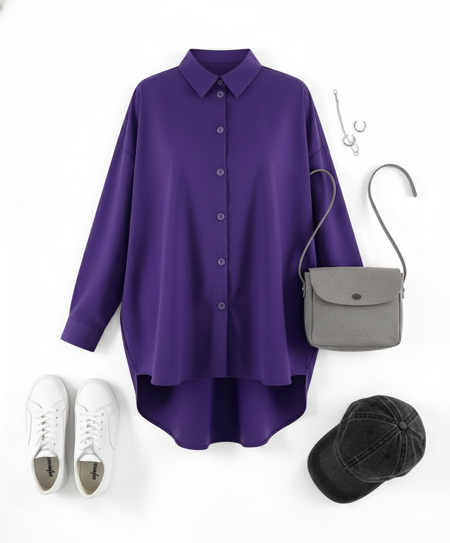 Blusa oversize de manga larga con caída holgada que impone presencia relajada